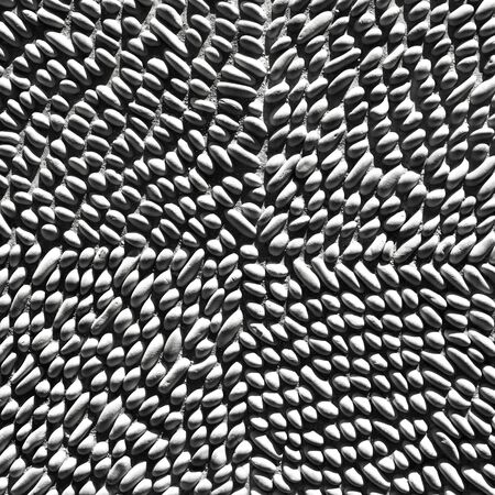 Abstract pattern of stone pebbles monochromeの写真素材