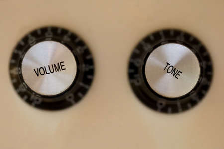 Top down close up shot of volume and tone guitar knobsの写真素材
