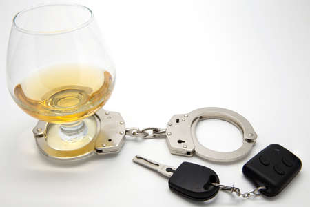 Alcohol, Handcuffs and Keys  - Drunk Driving Conceptの写真素材
