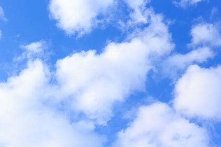 beautiful white cloudy on blue sky background at noon in Thailandの写真素材