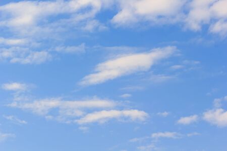 beautiful white cloudy on blue sky background at noon in Thailandの写真素材