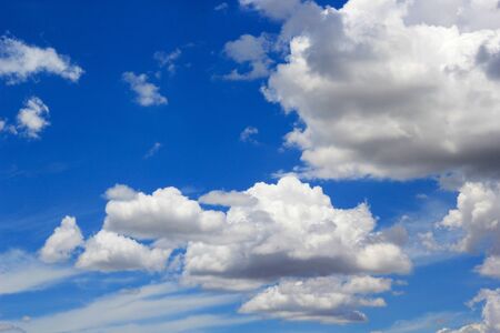 beautiful white cloudy on blue sky background at noon in Thailandの写真素材