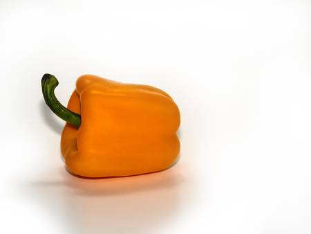 Yellow pepper pod, on a white backgroundの写真素材