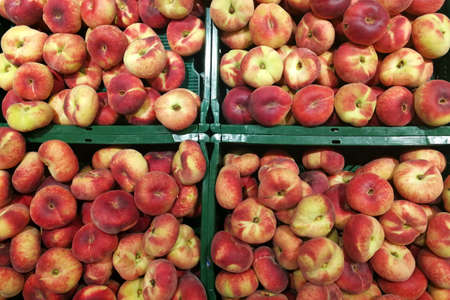 Platt peach, plate peach - Prunus persica in boxes for sale