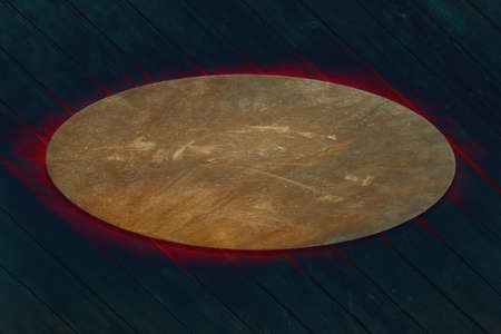 Old wooden wall with oval rusty metal sign on fire effectの写真素材