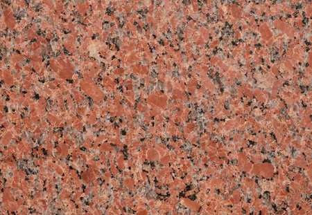 Elegant Close-Ups of a Polished Reddish Granite Slab - Perfect for Textures, Interior Design Inspiration, and Natural Stone Aesthetics in Architecture and Decor Projectsの写真素材