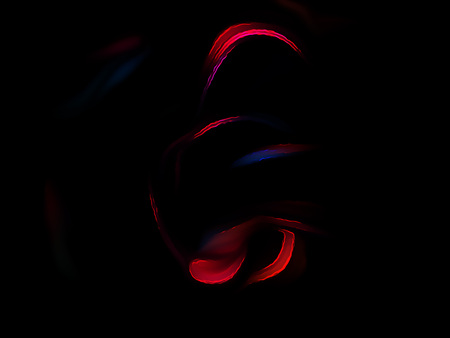 Red and blue fractal swirl on a black background. Perfect for design work, backgrounds or desktop wallpapers.の写真素材
