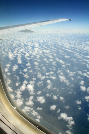 A window view of the blue sky with cloudsの写真素材