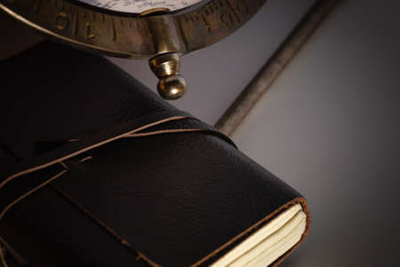 Leather notebook & globe travel background in dark lighting. travel explore exploration planning