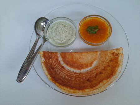 Paper dosa is a South Indian meal served with sambhar and coconut chutneyの写真素材