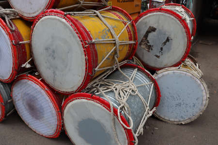 Big traditional indian drums used as a musical instrument. Drums are used during festivals to creat drum beats for all kinds of cultural and recreation activities. Maharastra and punjab carnival.の写真素材
