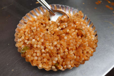 Sabudana khichadi is an Indian dish made from soaked sabudana. It is typically prepared in parts of Western India. Delicious and healthy indian breakfast.の写真素材