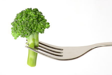 Healthy Eating - Broccoli on Fork isolated on white backgroundの写真素材