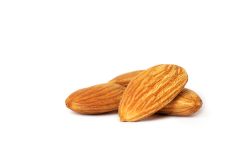 Almonds isolated on white backgroundの写真素材