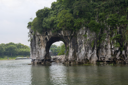 karst cave at the river bank on Li river, Guilinの写真素材