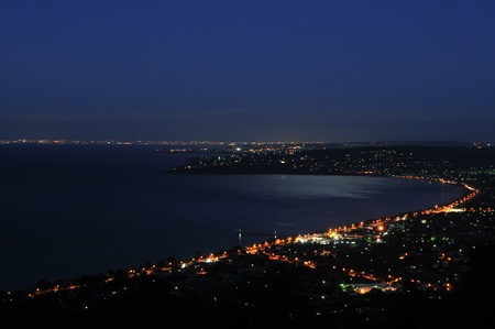Bay Night on the moon light and city lightsの写真素材