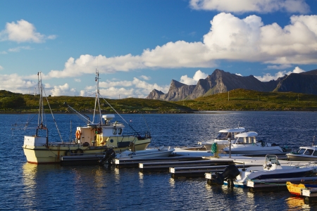 Fishing boat on Lofoten islands in Norway during arctic summerの写真素材