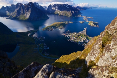 Scenic view of Lofoten islands from top of mountain Reinebringen with picturesque town of Reine and surrounding fjordsの写真素材