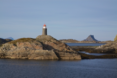 Rock islets with lighthouse on Lofoten islands in norwayの写真素材
