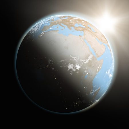 Space view of the sun rising over Africa on blue planet Earth.の写真素材