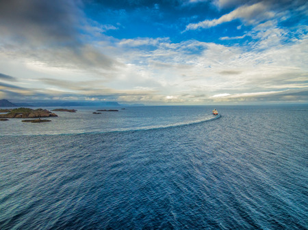 Aerial view of Hurtigruten leaving port on Lofoten islandsの写真素材