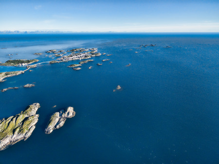 Aerial view of picturesque fishing port Henningsvaer on small islands in the seaの写真素材