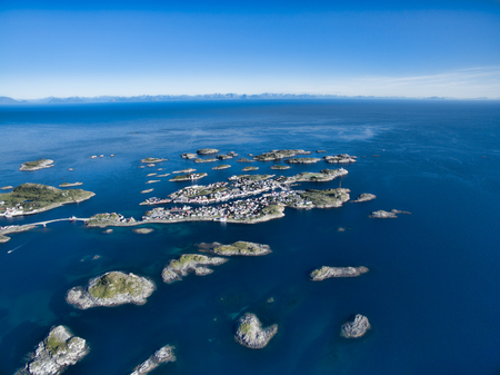 Aerial view of picturesque fishing port Henningsvaer on small islets in the seaの写真素材