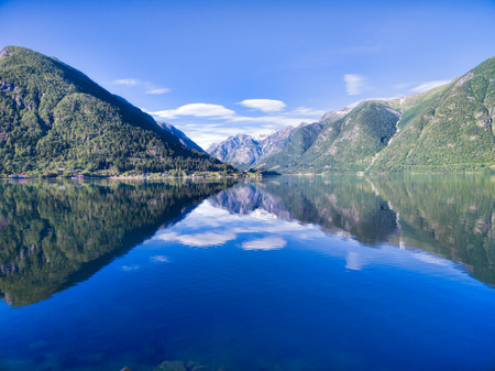 Scenic view of picturesque norwegian fjord surrounded by mountainsの写真素材