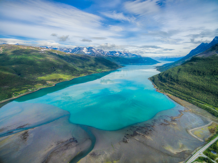 Aerial view of turquoise waters of Lyngen fjord in Norwayの写真素材