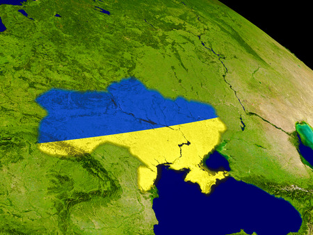Map of Ukraine with embedded flag on planet surface. 3D illustration.の写真素材