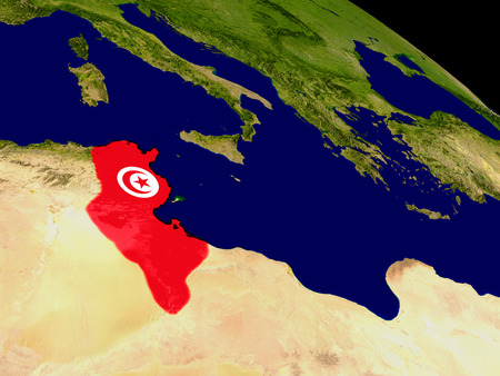 Map of Tunisia with embedded flag on planet surface. 3D illustration.の写真素材