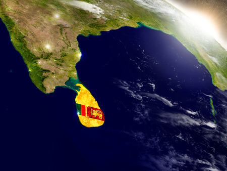 Sri Lanka with embedded flag on planet surface during sunrise. 3D illustration with highly detailed realistic planet surface and visible city lights.の写真素材
