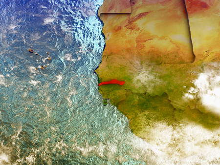 Gambia highlighted in red on illustrated globe with realistic ocean waters and clouds as seen from Earth's orbit in space. 3D illustration with high level of detail.の写真素材