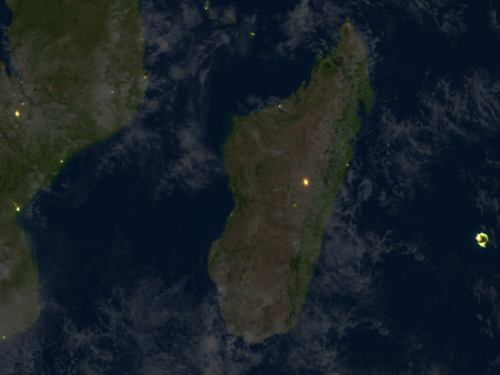 Madagascar at night. 3D illustration with detailed planet surface and visible city lights.の写真素材