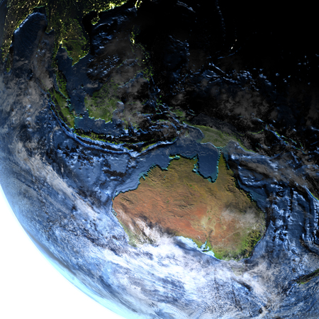 Australia on 3D model of Earth. 3D illustration with plastic planet surface and ocean floor at night and visible city lights.の写真素材