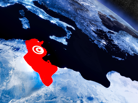 Tunisia with embedded national flag at night from space. 3D illustration with detailed planet surface and visible city lights.の写真素材