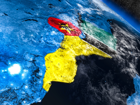 Mozambique with embedded national flag at night from space. 3D illustration with detailed planet surface and visible city lights.の写真素材