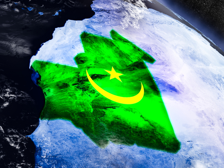 Mauritania with embedded national flag at night from space. 3D illustration with detailed planet surface and visible city lights.の写真素材