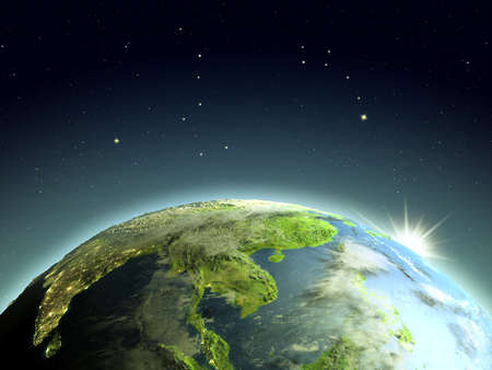 Indochina during sunrise from Earth's orbit in space. 3D illustration with detailed planet surface and visible city lights. Elements of this image furnished by NASA.の写真素材