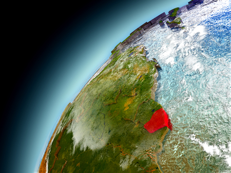 French Guiana as seen from orbit on model of Earth. 3D illustration with atmosphere and reflective ocean waters.の写真素材