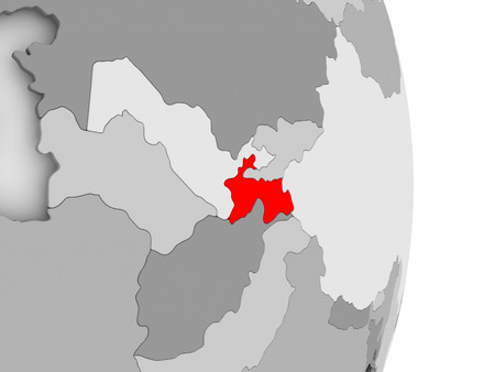 Tajikistan highlighted in red on grey political globe. 3D illustration.の写真素材