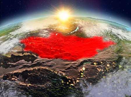 Satellite view of Mongolia highlighted in red on planet Earth with clouds during sunrise. 3D illustration.の写真素材