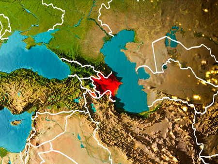 Azerbaijan in the morning highlighted in red on planet Earth with visible border lines and city lights. 3D illustration.の写真素材