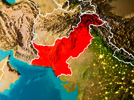 Pakistan in the morning highlighted in red on planet Earth with visible border lines and city lights. 3D illustration.の写真素材