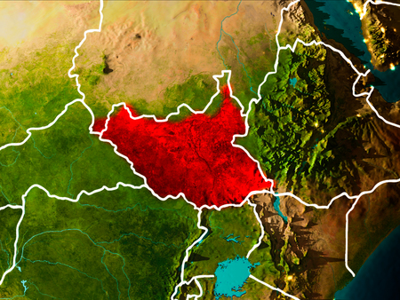 South Sudan in the morning highlighted in red on planet Earth with visible border lines and city lights. 3D illustration.の写真素材