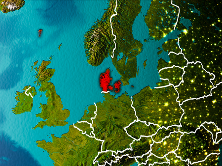 Denmark in the morning highlighted in red on planet Earth with visible border lines and city lights. 3D illustration.の写真素材