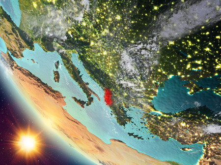 Albania during sunset highlighted in red on planet Earth with clouds. 3D illustration.の写真素材