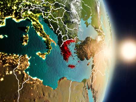 Greece during sunrise highlighted in red on planet Earth with visible country borders. 3D illustration.の写真素材