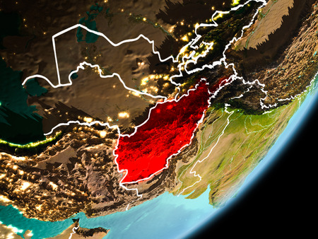 Afghanistan in early morning light highlighted in red on planet Earth with visible border lines and city lights. 3D illustration.の写真素材