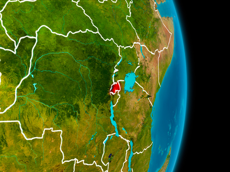 Rwanda in red on planet Earth with visible borderlines. 3D illustration.の写真素材